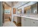 Bathroom with double vanity, soaking tub, and tiled floors at 69 Margaret Pl, Chapel Hill, NC 27516