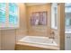 Bathroom featuring tub with decorative tiled backsplash at 69 Margaret Pl, Chapel Hill, NC 27516