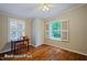 Comfortable bedroom with hardwood floors, natural light, and closet space, perfect for relaxation and storage at 69 Margaret Pl, Chapel Hill, NC 27516