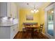 Cozy dining area with custom cabinetry, wood floors, and plenty of natural light, perfect for Gathering meals at 69 Margaret Pl, Chapel Hill, NC 27516