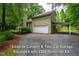 This property offers a lean-to carport and a two-car garage equipped with 220V Power at 69 Margaret Pl, Chapel Hill, NC 27516