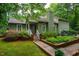 Charming home featuring a quaint porch, well-maintained landscaping and beautiful curb appeal at 69 Margaret Pl, Chapel Hill, NC 27516