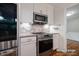 Updated kitchen showcasing stainless steel appliances and modern cabinetry, offering both style and functionality at 69 Margaret Pl, Chapel Hill, NC 27516