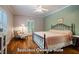 Spacious owner's suite featuring hardwood floors, sitting area, and ceiling fan at 69 Margaret Pl, Chapel Hill, NC 27516