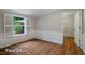 Versatile room with hardwood floors and ample natural light, ideal for a home office or flexible living space at 69 Margaret Pl, Chapel Hill, NC 27516