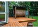 Outdoor sauna barrel on wooden deck with greenery nearby at 69 Margaret Pl, Chapel Hill, NC 27516