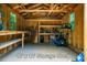 Spacious 10' x 12' storage shed with ample shelving and natural light from windows, ideal for organization and storage at 69 Margaret Pl, Chapel Hill, NC 27516