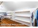 Extra-large walk-in closet with built-in shelving for ample storage at 69 Margaret Pl, Chapel Hill, NC 27516