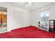 Cozy bedroom featuring carpet, closet, and window at 6909 Hickory Dr, Raleigh, NC 27603