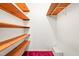 Walk-in closet featuring wooden shelving offering practical storage solutions at 6909 Hickory Dr, Raleigh, NC 27603