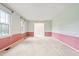 Bright living room featuring carpeted floors, light walls and large windows at 6909 Hickory Dr, Raleigh, NC 27603
