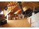 Unfinished attic space showing exposed rafters and stored boxes at 70 Glen Oaks Drive Dr, Youngsville, NC 27596