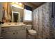 Neutral bathroom featuring a vanity, toilet, and shower with patterned curtain at 70 Glen Oaks Drive Dr, Youngsville, NC 27596