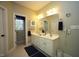 Bathroom with a double sink vanity and a separate toilet room at 70 Glen Oaks Drive Dr, Youngsville, NC 27596