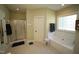 Bathroom featuring a tub and a glass-enclosed shower at 70 Glen Oaks Drive Dr, Youngsville, NC 27596