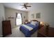 A serene bedroom with dark wood furniture and ample natural light at 70 Glen Oaks Drive Dr, Youngsville, NC 27596