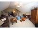 Spacious bonus room with ample seating and a built-in desk at 70 Glen Oaks Drive Dr, Youngsville, NC 27596