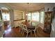 Bright dining area with a wood table, chairs, and a decorative hutch and corner cabinet at 70 Glen Oaks Drive Dr, Youngsville, NC 27596