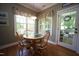 Cozy dining area with a round table, comfortable chairs, and bright natural light at 70 Glen Oaks Drive Dr, Youngsville, NC 27596
