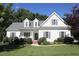 Inviting two-story home with a well-manicured lawn, charming front porch, and classic curb appeal at 70 Glen Oaks Drive Dr, Youngsville, NC 27596