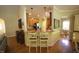Open kitchen area with granite countertops, stainless steel appliances, and counter seating at 70 Glen Oaks Drive Dr, Youngsville, NC 27596