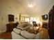 Inviting living room featuring a fireplace, vaulted ceiling, and open access to adjacent rooms at 70 Glen Oaks Drive Dr, Youngsville, NC 27596