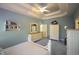 This main bedroom is brightly lit with a trey ceiling and light blue walls at 70 Glen Oaks Drive Dr, Youngsville, NC 27596