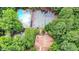 Aerial view of community pool, playground, and tennis courts amidst lush greenery at 73 Stoneridge Rd, Durham, NC 27705