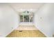 Bright dining area with large windows offering a serene view of the wooded surroundings, and tiled flooring at 73 Stoneridge Rd, Durham, NC 27705