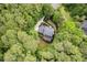 Aerial shot of a home surrounded by lush greenery, providing a sense of seclusion and natural beauty at 7811 Still Crossing Rd, Chapel Hill, NC 27516