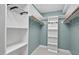 Walk-in closet with custom shelving and organization system at 7811 Still Crossing Rd, Chapel Hill, NC 27516