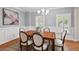 Elegant dining room featuring decorative woodworking and large windows at 7811 Still Crossing Rd, Chapel Hill, NC 27516