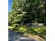 The Glynmorgan neighborhood entrance features lush landscaping and a stone sign at 7811 Still Crossing Rd, Chapel Hill, NC 27516