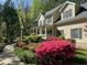Traditional home with charming porch and manicured landscaping including azaleas at 7811 Still Crossing Rd, Chapel Hill, NC 27516