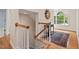 Entryway features hardwood floors, staircase and a large window providing an abundance of natural light at 7811 Still Crossing Rd, Chapel Hill, NC 27516