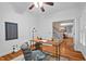 Comfortable home office area featuring hardwood floors and natural light at 7811 Still Crossing Rd, Chapel Hill, NC 27516