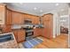 Modern kitchen features stainless steel appliances, granite countertops, and lots of cabinet space at 7811 Still Crossing Rd, Chapel Hill, NC 27516