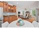 Eat-in kitchen flows into living room and features stainless steel appliances and ample cabinet space at 7811 Still Crossing Rd, Chapel Hill, NC 27516