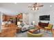 Open-concept living area with hardwood floors connecting to the kitchen at 7811 Still Crossing Rd, Chapel Hill, NC 27516