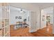 Bright home office with hardwood floors, french doors, and ample natural light at 7811 Still Crossing Rd, Chapel Hill, NC 27516