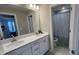 Bathroom featuring a double vanity with a walk-in shower at 803 Courting St, Apex, NC 27523