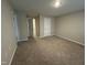 Large bedroom with plush carpeting, natural light, and ample closet space at 803 Courting St, Apex, NC 27523