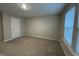Cozy bedroom with plush carpet, a closet, and natural light at 803 Courting St, Apex, NC 27523