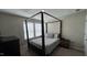 Comfortable bedroom featuring a large bed frame with dresser and natural lighting at 803 Courting St, Apex, NC 27523