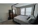 Comfortable bedroom featuring a large bed frame with dresser and natural lighting at 803 Courting St, Apex, NC 27523