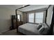 Comfortable bedroom featuring a large bed frame with dresser and natural lighting at 803 Courting St, Apex, NC 27523
