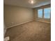 Spacious bedroom features neutral carpet, natural light, and closet at 803 Courting St, Apex, NC 27523