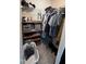 Walk-in closet featuring ample storage space with shelving and hanging racks at 803 Courting St, Apex, NC 27523