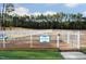 This community dog park is well maintained, fenced and has a sign to welcome your furry friend to play at 803 Courting St, Apex, NC 27523