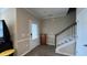 Welcoming foyer with staircase, stylish flooring, and neutral walls, creating a warm first impression at 803 Courting St, Apex, NC 27523